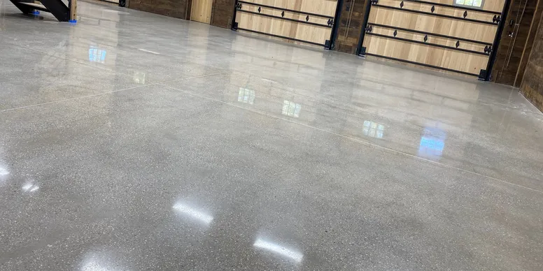 Mirror-polished concrete floor in a residential garage interior